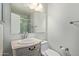 Neat bathroom includes modern fixtures and a clean design, with a toilet and sink beside a large mirror at 5704 E Aire Libre Ave # 1093, Scottsdale, AZ 85254