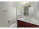 Clean and modern bathroom features updated fixtures and a shower, beside a toilet and vanity with mirror at 5704 E Aire Libre Ave # 1093, Scottsdale, AZ 85254