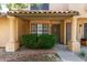 Charming front entrance with decorative pillars, tile roof, well-kept landscaping, and security door at 5704 E Aire Libre Ave # 1093, Scottsdale, AZ 85254
