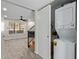 Convenient in-unit laundry area with stacked washer and dryer, located off the living space and stairway at 5704 E Aire Libre Ave # 1093, Scottsdale, AZ 85254