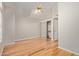 Bright bedroom features hardwood floors, a ceiling fan, and a mirrored closet at 5704 E Aire Libre Ave # 1093, Scottsdale, AZ 85254