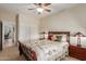 Comfortable bedroom with a ceiling fan, and sliding door closet at 6418 S Pinaleno Pl, Chandler, AZ 85249