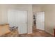 Bedroom with sliding door closet and a view into another room at 6418 S Pinaleno Pl, Chandler, AZ 85249