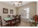 Traditional dining room with ample seating and shuttered windows at 6418 S Pinaleno Pl, Chandler, AZ 85249