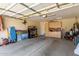 Spacious garage featuring built-in storage cabinets, and ample space for parking and other household needs at 6418 S Pinaleno Pl, Chandler, AZ 85249