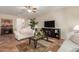 Cozy living room featuring tile flooring and comfortable seating at 6418 S Pinaleno Pl, Chandler, AZ 85249