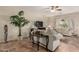 Comfortable living room featuring tile flooring, neutral tones, and ample natural light at 6418 S Pinaleno Pl, Chandler, AZ 85249