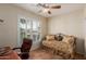 Well-lit office space with a comfortable chair, and shuttered window at 6418 S Pinaleno Pl, Chandler, AZ 85249