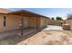 Spacious backyard with a pizza oven, brick wall and covered patio at 7340 W Meadowbrook Ave, Phoenix, AZ 85033