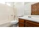 Cozy bathroom with a shower-tub combination and dark wood vanity at 7340 W Meadowbrook Ave, Phoenix, AZ 85033