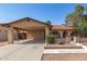 Charming home with a covered carport, landscaped front yard, and a welcoming entrance at 7340 W Meadowbrook Ave, Phoenix, AZ 85033
