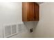 Laundry room with storage cabinets, ventilation and electrical outlets at 7340 W Meadowbrook Ave, Phoenix, AZ 85033