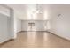 Bright, spacious living room with tile floors, a ceiling fan, and a sliding glass door to the backyard at 7340 W Meadowbrook Ave, Phoenix, AZ 85033