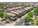 Aerial view of closely-knit neighborhood with well-maintained homes, mature trees, and convenient street access at 7718 W Pipestone Pl, Phoenix, AZ 85035