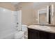 Neutral bathroom featuring a shower-tub combination, toilet, and vanity with modern fixtures at 7718 W Pipestone Pl, Phoenix, AZ 85035