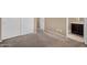 This bedroom includes carpet, neutral walls, and access to a small bathroom at 7718 W Pipestone Pl, Phoenix, AZ 85035