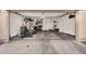 Spacious two car garage with concrete floor and high ceilings at 7718 W Pipestone Pl, Phoenix, AZ 85035