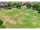 Expansive green space with mature trees provides a picturesque and serene environment for the community at 7718 W Pipestone Pl, Phoenix, AZ 85035