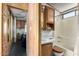 Bathroom showcasing wood cabinets, vanity, toilet, and tub shower with neutral finishes at 7750 E Broadway Rd # 357, Mesa, AZ 85208