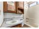 Bathroom features a vanity with wood cabinets, toilet, and shower/tub combo at 7750 E Broadway Rd # 357, Mesa, AZ 85208