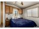 Cozy bedroom with wood cabinetry, window, and comfortable furnishings at 7750 E Broadway Rd # 357, Mesa, AZ 85208