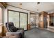 Comfortable living space featuring carpeting, cabinet storage, and outdoor access at 7750 E Broadway Rd # 357, Mesa, AZ 85208