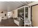 An outdoor porch featuring neutral furniture and a well lit entryway to the home at 7750 E Broadway Rd # 357, Mesa, AZ 85208