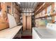 Spacious laundry/storage room features utility sink and ample shelving at 7750 E Broadway Rd # 357, Mesa, AZ 85208