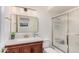 Bathroom boasts a white vanity, decorative mirror, and a walk-in shower at 837 W Keating Ave, Mesa, AZ 85210