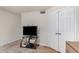 Bedroom with a modern TV stand and ample closet space offers storage at 837 W Keating Ave, Mesa, AZ 85210