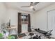 Bedroom with a ceiling fan, workout machine, and a bright window at 837 W Keating Ave, Mesa, AZ 85210