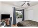 Bedroom featuring an airy window with backyard views and ceiling fan at 837 W Keating Ave, Mesa, AZ 85210