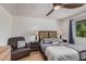 Bedroom with a comfortable chair and ceiling fan at 837 W Keating Ave, Mesa, AZ 85210