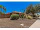 A single-story home exhibiting xeriscaping and mature shrubs for low maintenance at 837 W Keating Ave, Mesa, AZ 85210