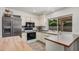 Bright kitchen showcasing ample countertop space, appliances, and a view to the exterior at 837 W Keating Ave, Mesa, AZ 85210