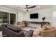 A living room features a large sectional sofa and view of the backyard at 837 W Keating Ave, Mesa, AZ 85210