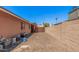 Side yard features low maintenance landscaping and block wall fencing for privacy and functionality at 837 W Keating Ave, Mesa, AZ 85210