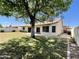Spacious backyard with grass and shaded patio at 8759 W Port Au Prince Ln, Peoria, AZ 85381
