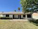 Beautiful backyard featuring a covered patio and grass at 8759 W Port Au Prince Ln, Peoria, AZ 85381