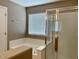 Modern bathroom with bathtub and a glass-enclosed shower at 8759 W Port Au Prince Ln, Peoria, AZ 85381