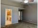 Bedroom with carpet and view to the bathroom at 8759 W Port Au Prince Ln, Peoria, AZ 85381