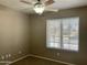 Bedroom with ceiling fan and window for natural light at 8759 W Port Au Prince Ln, Peoria, AZ 85381