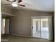Bedroom with sliding glass door and carpet, perfect for relaxation and privacy at 8759 W Port Au Prince Ln, Peoria, AZ 85381