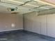 Attached garage featuring built in cabinets for extra storage at 8759 W Port Au Prince Ln, Peoria, AZ 85381