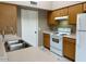 Well-lit kitchen featuring stainless steel appliances and light countertops at 8759 W Port Au Prince Ln, Peoria, AZ 85381