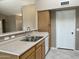 A well-kept kitchen space with durable countertops and bright cabinets at 8759 W Port Au Prince Ln, Peoria, AZ 85381