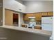 Open concept kitchen with modern appliances and lots of cabinet space at 8759 W Port Au Prince Ln, Peoria, AZ 85381