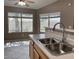 Kitchen with stainless steel faucet and sink with view to the backyard at 8759 W Port Au Prince Ln, Peoria, AZ 85381