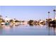 Scenic lake view with waterfront homes and boats docked along the shoreline at 8759 W Port Au Prince Ln, Peoria, AZ 85381