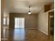 Bright, open living room with tiled floors, sliding glass doors and ample natural light at 8759 W Port Au Prince Ln, Peoria, AZ 85381